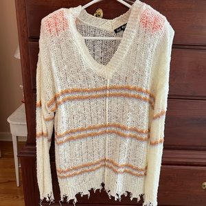 Trendy stylish sweater. Finished hem and sleeves with ripped edging.